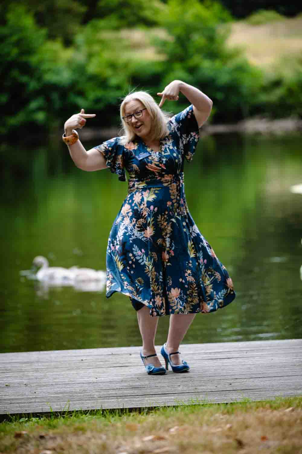Deb Reed Celebrant Essex Colchester posing with arms out smiling.